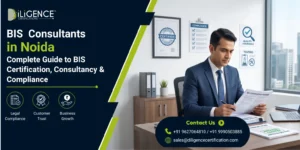Promotional banner for iLIGENCE Certifications titled "BIS Consultants in Noida: Complete Guide to BIS Consultancy, Certification & Compliance," showing two professionals reviewing documents in an office, alongside icons for legal compliance, customer trust, and business growth,